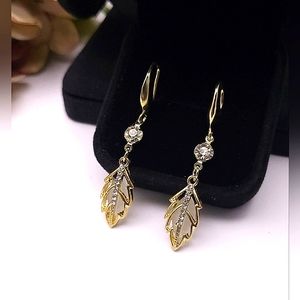 Elegant gold dangle earrings with rhinestones and leaf accent. New!
